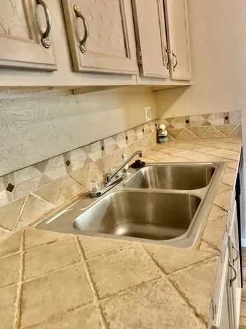 a kitchen with a stove and a microwave