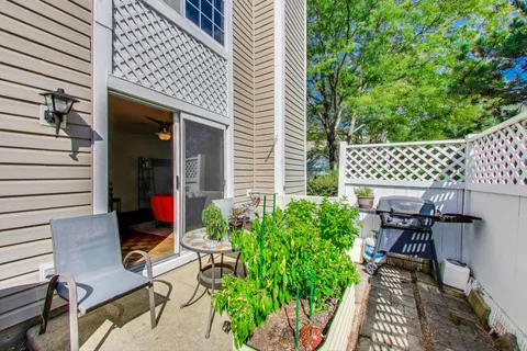 a view of a chairs and table in the patio