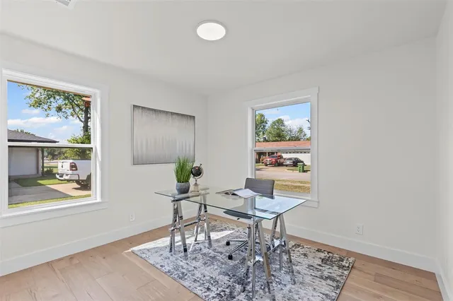 a workspace with furniture and a window