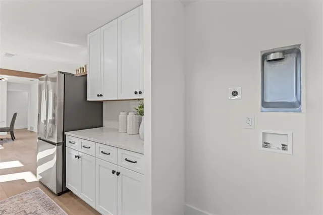 a kitchen with stainless steel appliances a stove and a refrigerator