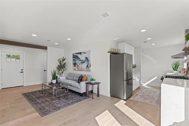 a living room with furniture and a rug