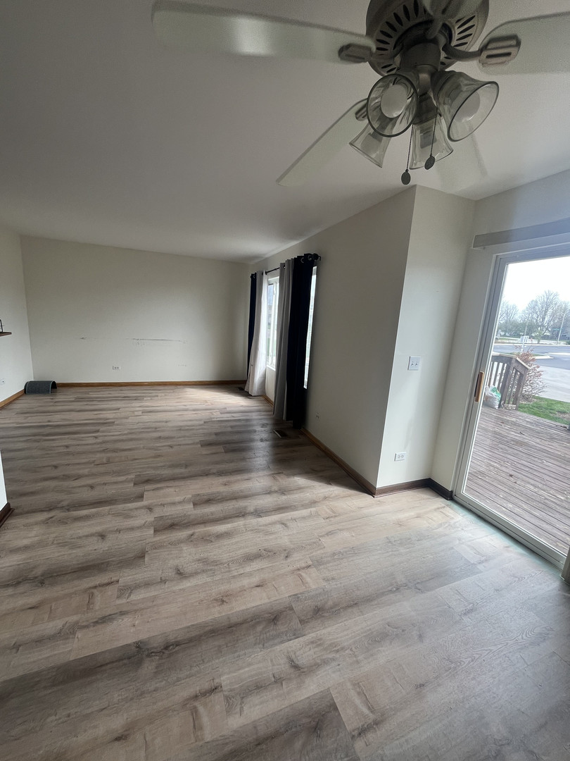 506 Prairie View Drive, Unit 506 Minooka, IL 60447 - Photo 2 of 12 a view of a hallway with a chandelier