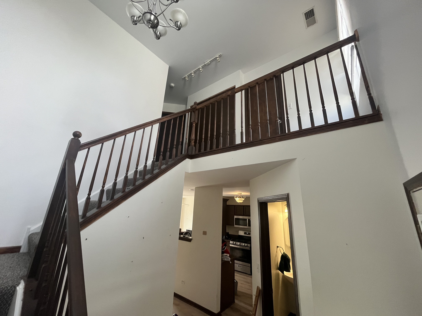 506 Prairie View Drive, Unit 506 Minooka, IL 60447 - Photo 8 of 12 a view of staircase with railing and white walls
