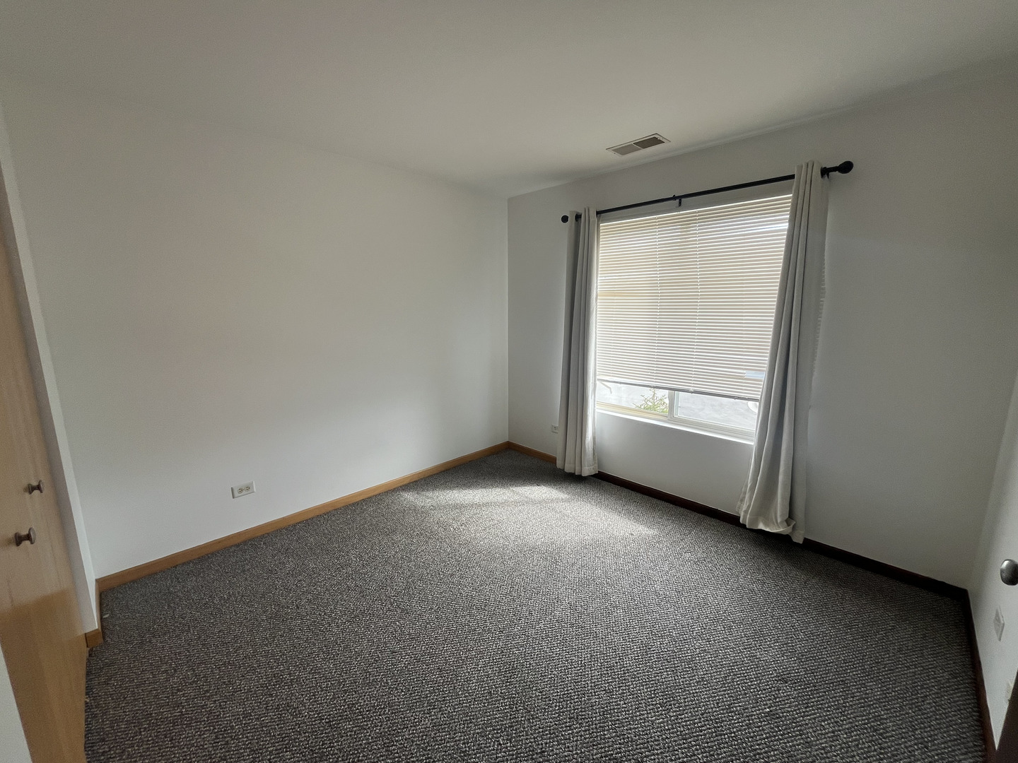 506 Prairie View Drive, Unit 506 Minooka, IL 60447 - Photo 9 of 12 a view of an empty room with a window