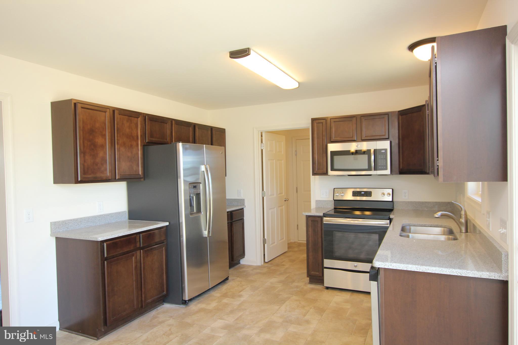 6998 Sharptown Road Laurel, DE 19956 - Photo 7 of 22 *Picture of similar model w/upgraded appliances.