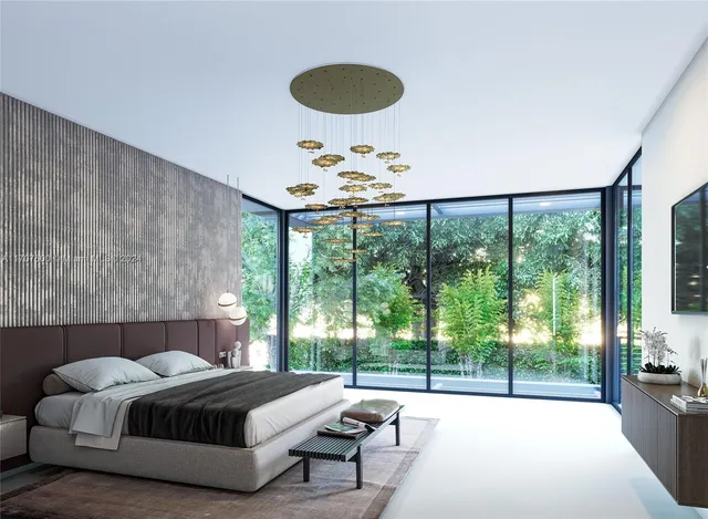 a spacious bedroom with a bed and a large window