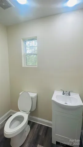 a bathroom with a toilet and a sink