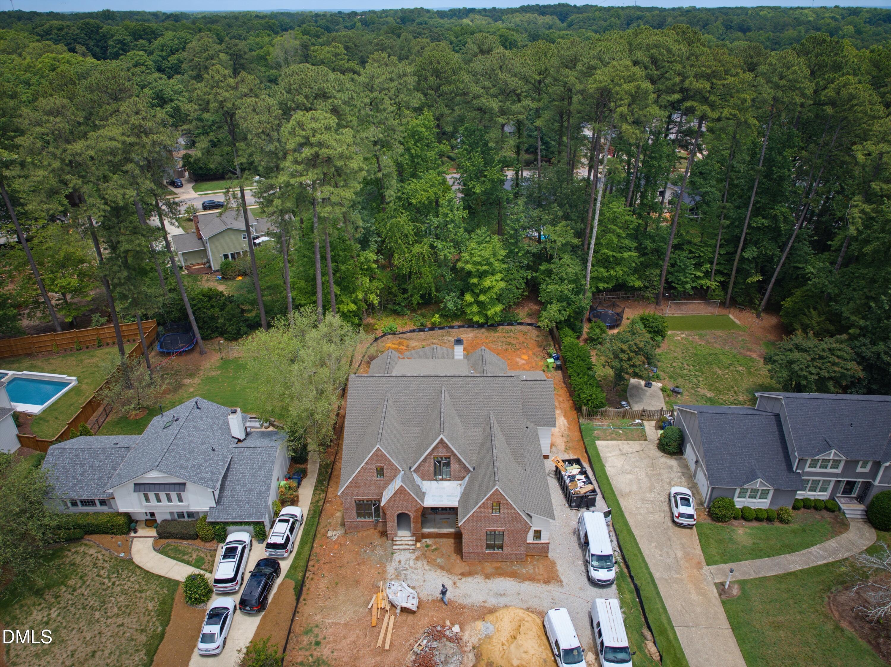 7508 Grist Mill Road Raleigh, NC 27615 - Photo 27 of 32 an aerial view of a house with garden space and street view
