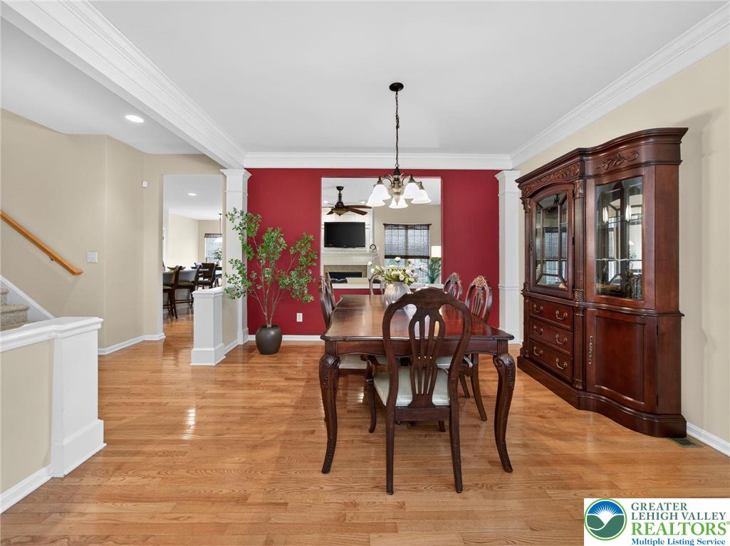 8611 Cascade Road Breinigsville, PA 18031 - Photo 11 of 40 a view of a dining room with furniture window and wooden floor