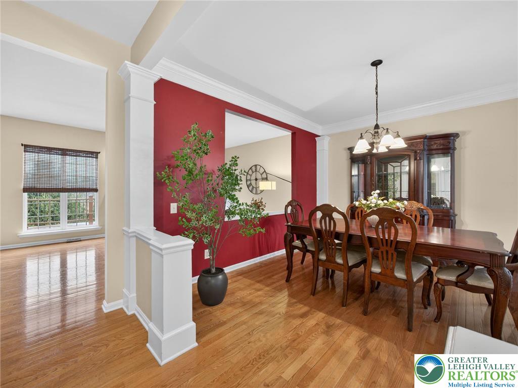 8611 Cascade Road Breinigsville, PA 18031 - Photo 12 of 40 a view of a dining room with furniture window and wooden floor