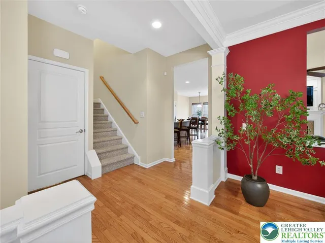 a view of a living room with furniture and flowers