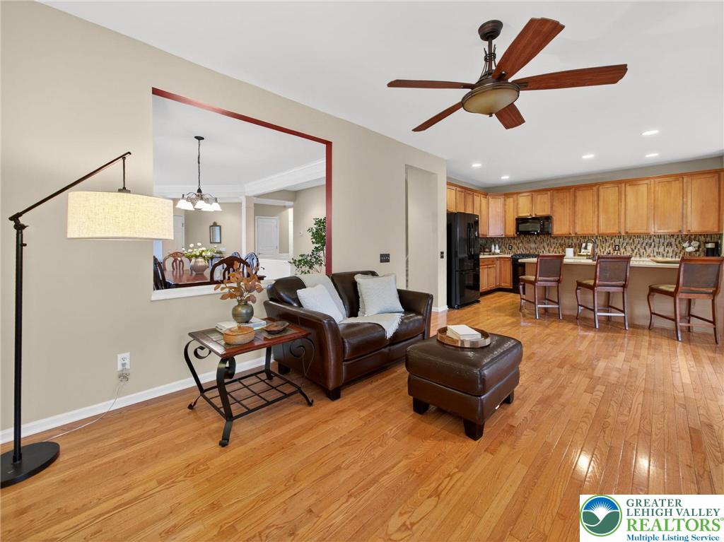 8611 Cascade Road Breinigsville, PA 18031 - Photo 17 of 40 a living room with furniture and a wooden floor