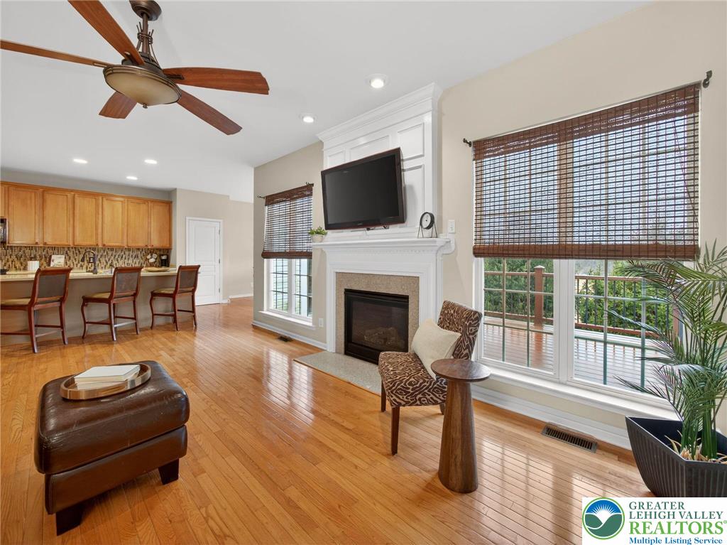 8611 Cascade Road Breinigsville, PA 18031 - Photo 18 of 40 a living room with furniture fireplace and flat screen tv