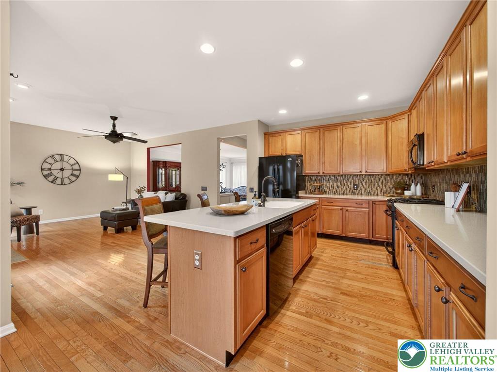 8611 Cascade Road Breinigsville, PA 18031 - Photo 22 of 40 a large kitchen with stainless steel appliances granite countertop a large center island and a sink
