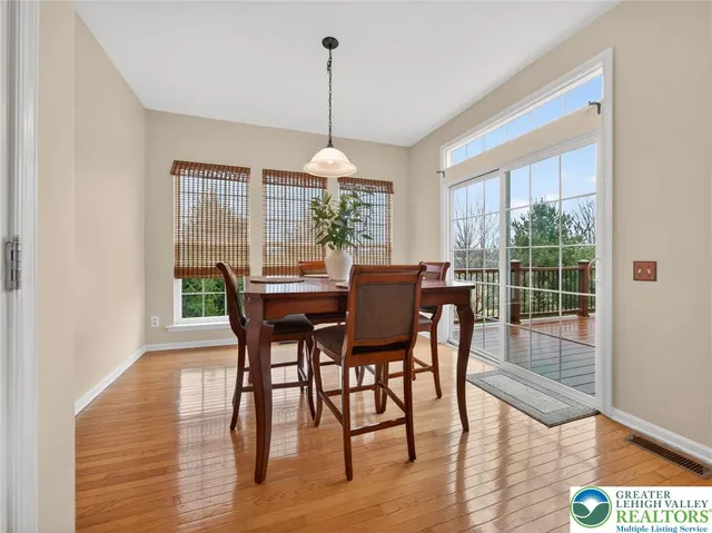 a dining room with furniture window wooden floor