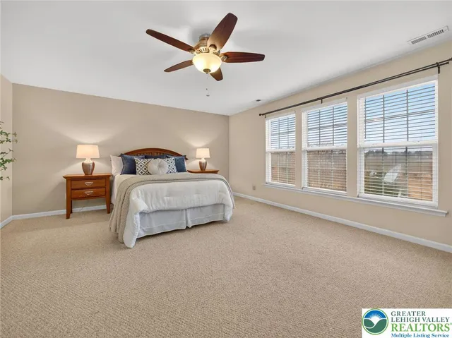 a bedroom with bed and window