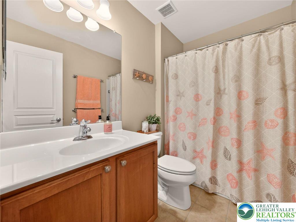 8611 Cascade Road Breinigsville, PA 18031 - Photo 33 of 40 a bathroom with a sink a toilet and a mirror