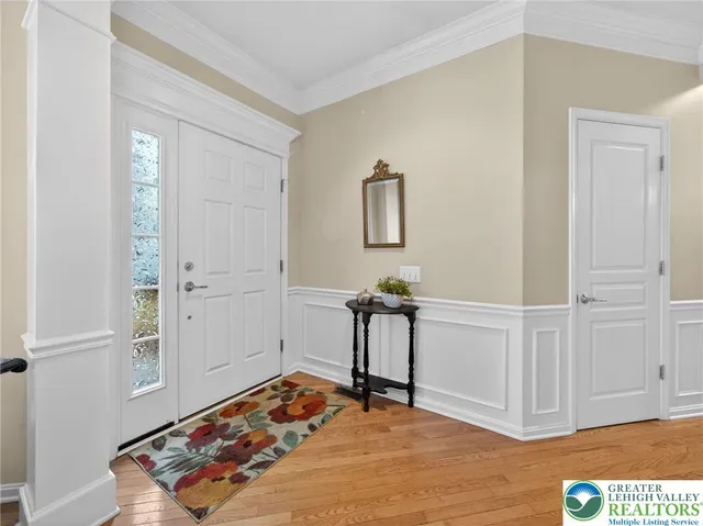 a view of a livingroom with wooden floor and cabinet
