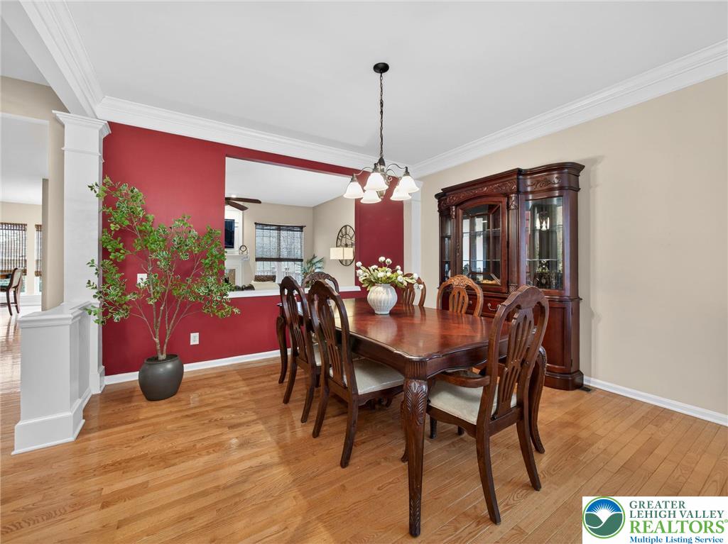 8611 Cascade Road Breinigsville, PA 18031 - Photo 9 of 40 a view of a dining room with furniture and wooden floor