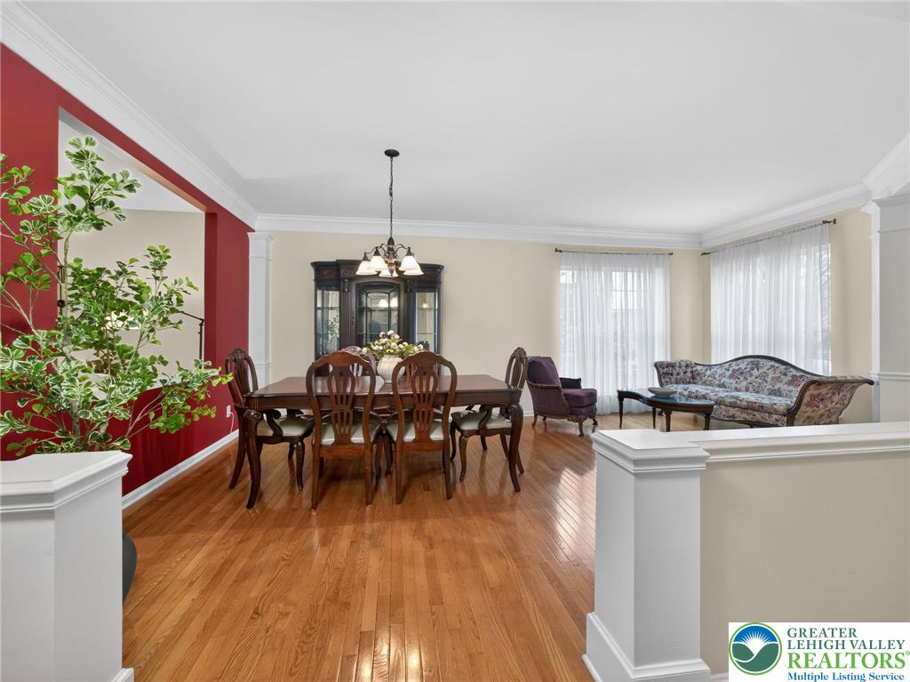 8611 Cascade Road Breinigsville, PA 18031 - Photo 10 of 40 a view of a dining room with furniture and wooden floor