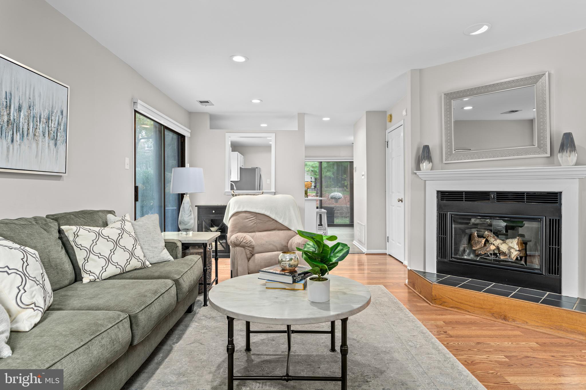 1 Flintlock Lane Chesterbrook, PA 19087 - Photo 3 of 39 Living room with fireplace and sliders to side pat