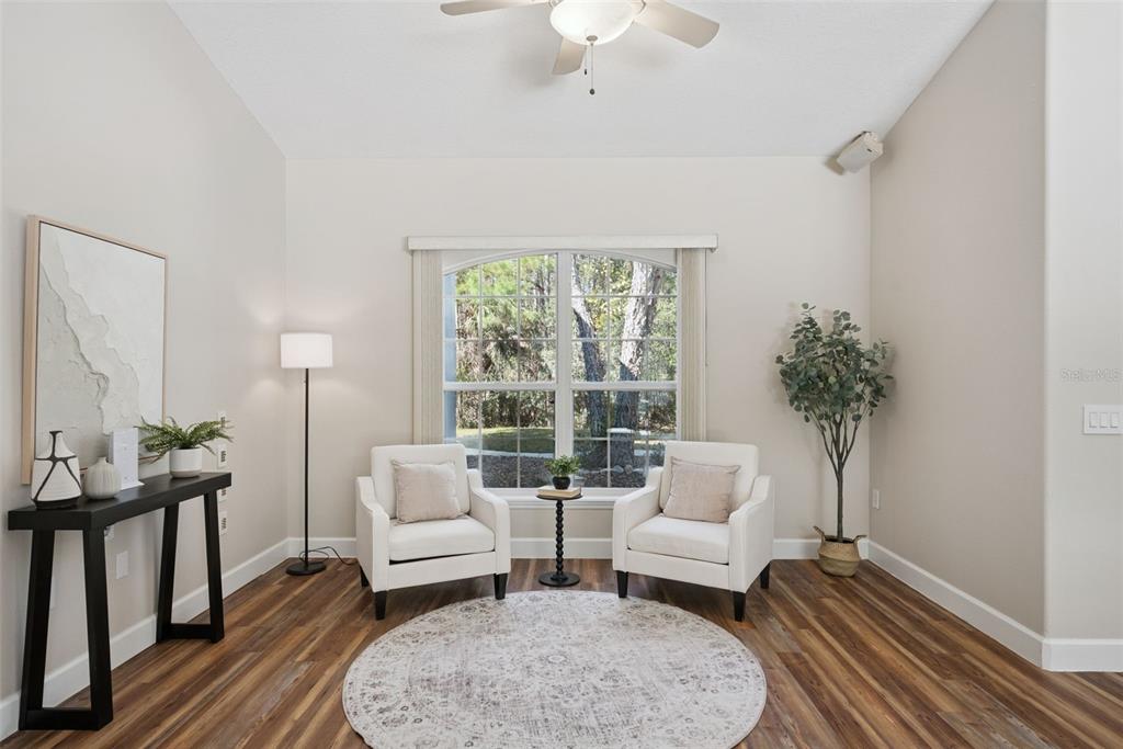3441 Hickory Creek Road Deltona, FL 32738 - Photo 11 of 62 a living room with furniture and wooden floor