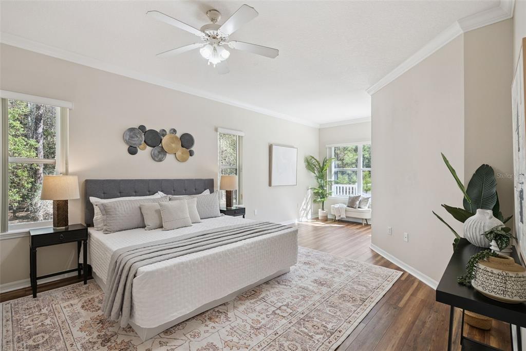 3441 Hickory Creek Road Deltona, FL 32738 - Photo 12 of 62 a bed room with a bed a couch and a window