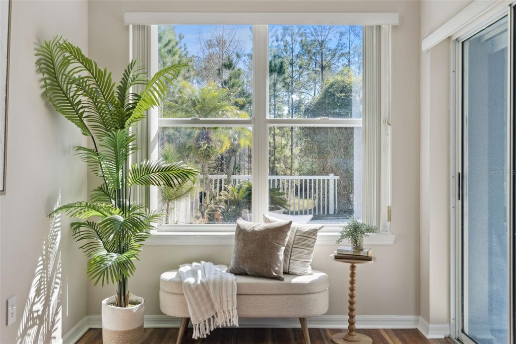 3441 Hickory Creek Road Deltona, FL 32738 - Photo 15 of 62 a living room filled with furniture and a potted plant