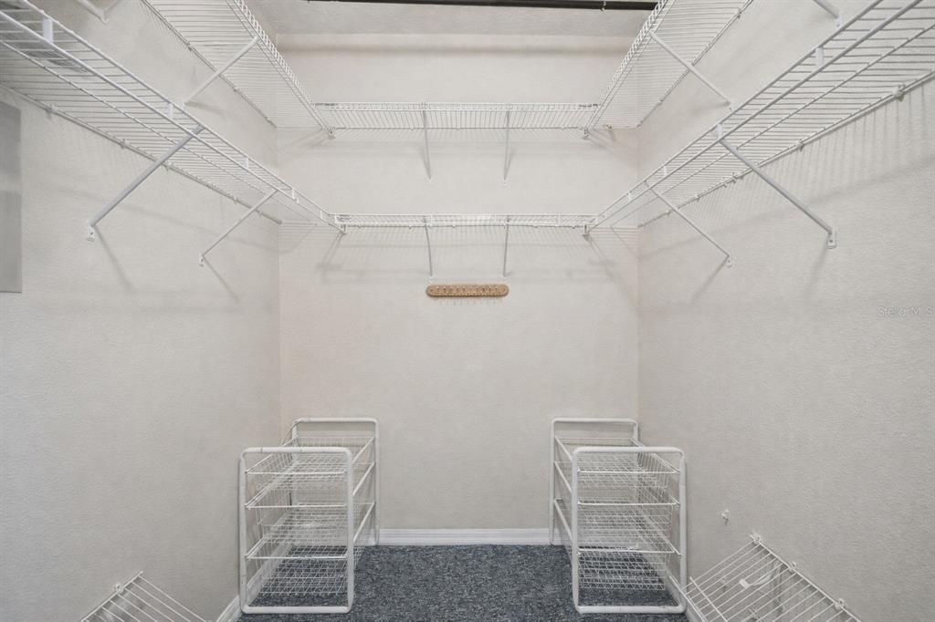 3441 Hickory Creek Road Deltona, FL 32738 - Photo 19 of 62 a room with a chair and table