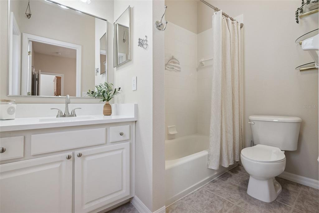 3441 Hickory Creek Road Deltona, FL 32738 - Photo 30 of 62 a bathroom with a sink toilet and shower