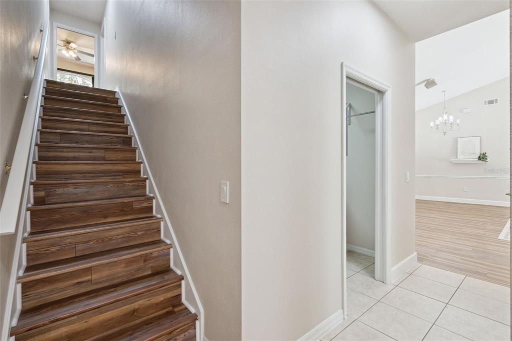 3441 Hickory Creek Road Deltona, FL 32738 - Photo 31 of 62 a view of a hallway with wooden floor and entryway