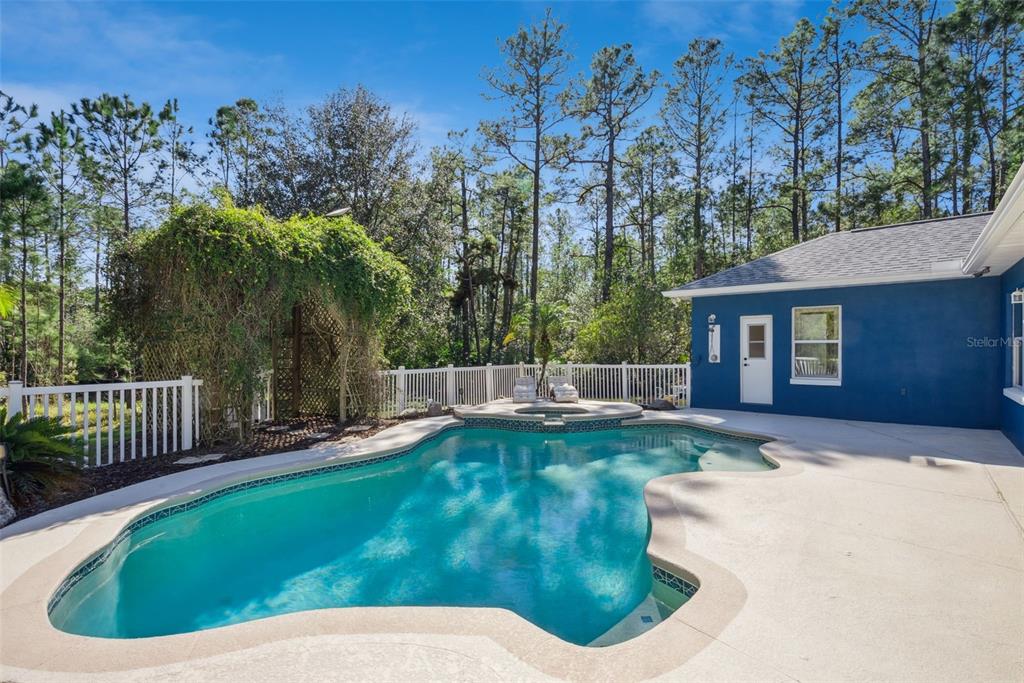 3441 Hickory Creek Road Deltona, FL 32738 - Photo 42 of 62 a view of a house with backyard porch and sitting area