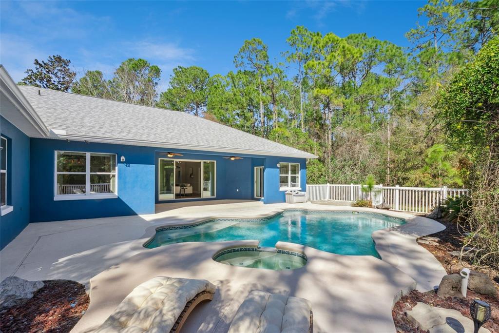 3441 Hickory Creek Road Deltona, FL 32738 - Photo 44 of 62 a front view of a house with a yard and porch