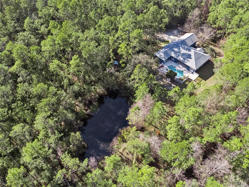 3441 Hickory Creek Road Deltona, FL 32738 - Photo 54 of 62 an aerial view of a house with a yard