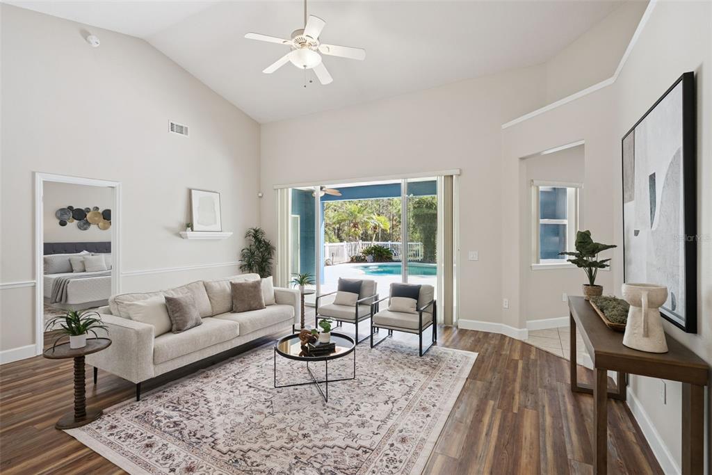 3441 Hickory Creek Road Deltona, FL 32738 - Photo 9 of 62 a living room with furniture and a large window