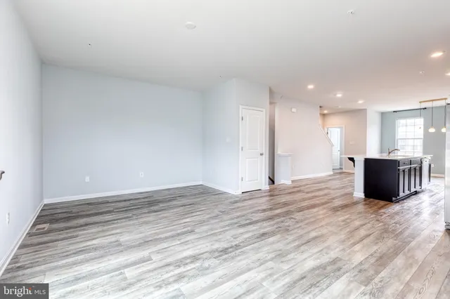 a view of a kitchen with a sink and a stove top oven