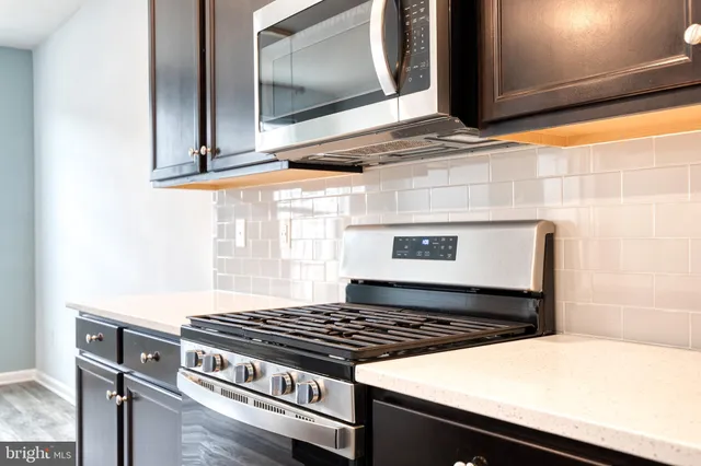 a kitchen with a stove and a microwave
