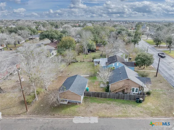 an aerial view of a house with a garden