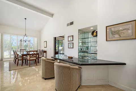 a dining room with furniture and window