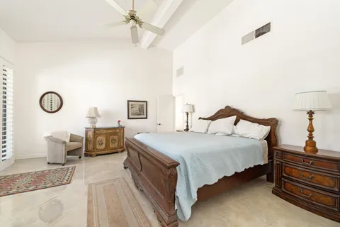 a bedroom with bed and window