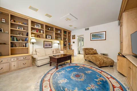 a bedroom with furniture and window
