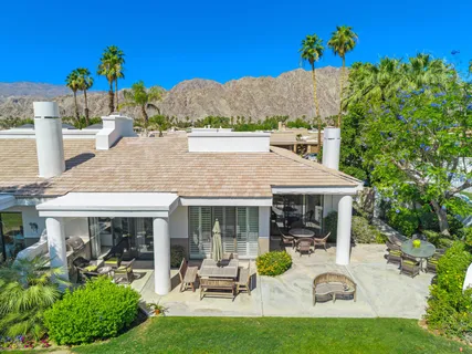 a view of a house with patio outdoor seating