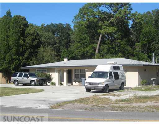 815 Crenshaw Lake Road Lutz, FL 33548 - Photo 1 of 1 Exterior Front - Big circular drive