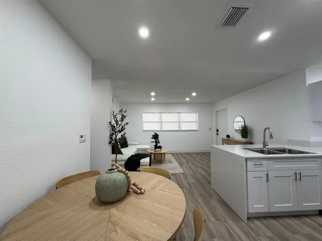 a kitchen with a sink and cabinets