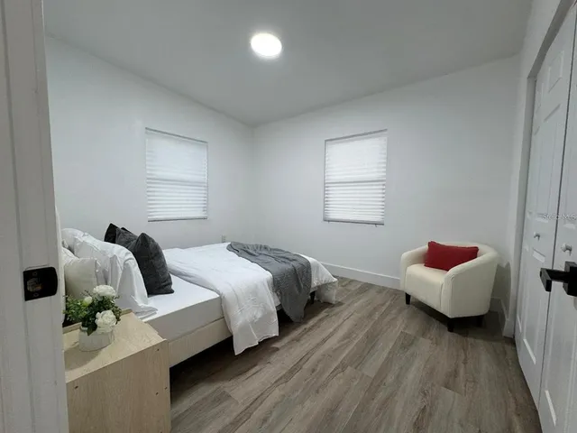 a bedroom with a bed and window