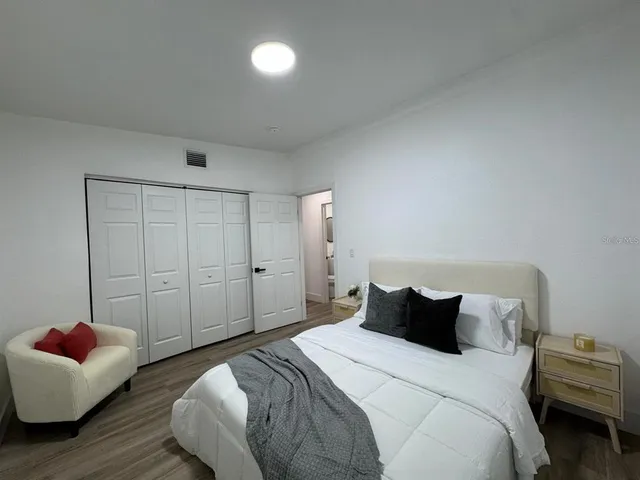 a bedroom with bed and window