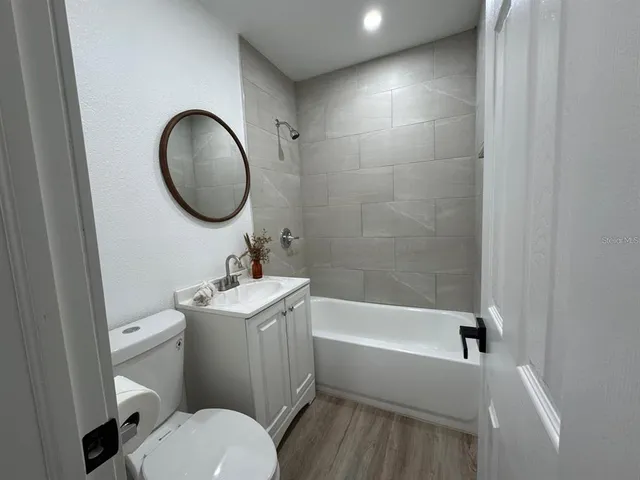 a bathroom with a sink toilet and a bathtub