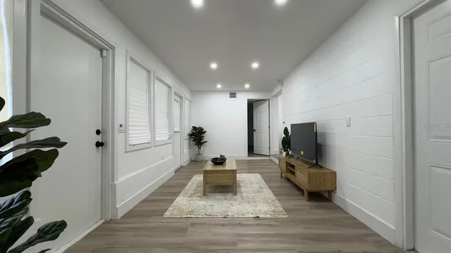 a view of a living room and a flat screen tv