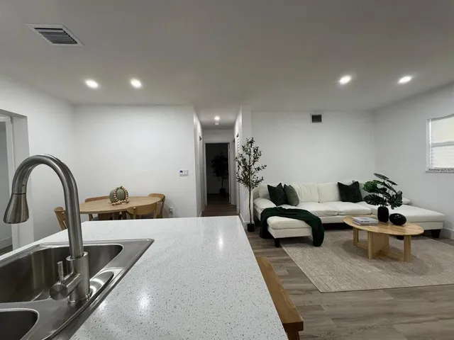 a bedroom with furniture and a mirror