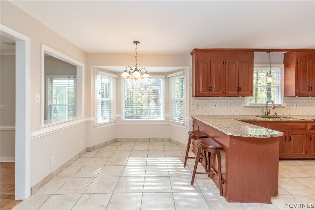 14301 Huntgate Woods Road Midlothian, VA 23112 - Photo 11 of 34 a kitchen with stainless steel appliances granite countertop a sink stove and cabinets